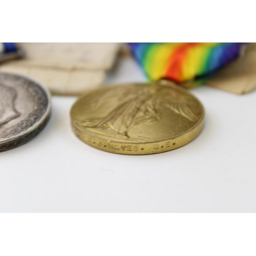 69 - A pair of WWI medals issued to SAPPER. J. HAYES RE in original cardboard boxes. (2)