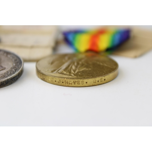 69 - A pair of WWI medals issued to SAPPER. J. HAYES RE in original cardboard boxes. (2)