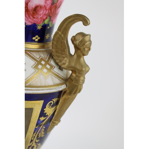 127 - 19th century porcelain vase, double handled in the form of figureheads, pink rose design, gilt highl... 