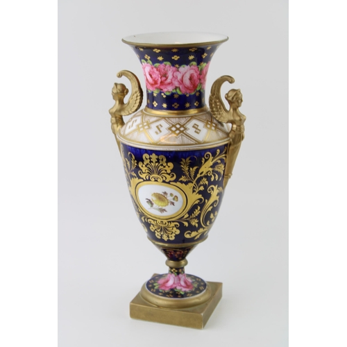 127 - 19th century porcelain vase, double handled in the form of figureheads, pink rose design, gilt highl... 