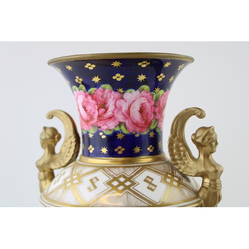 127 - 19th century porcelain vase, double handled in the form of figureheads, pink rose design, gilt highl... 