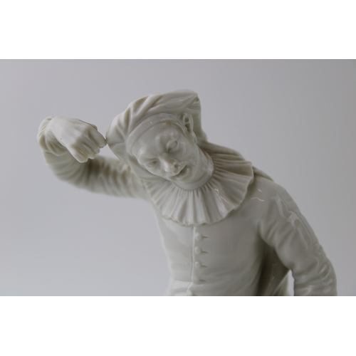 129 - Nymphenburg white glazed ceramic figure of Scaramouche with impressed to the base No 240, 19cm tall.