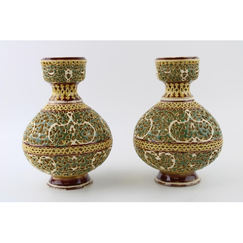 131 - Zsolnay Pecs: a pair of reticulated pedestal vases, ornate pierced decoration, predominantly decorat... 