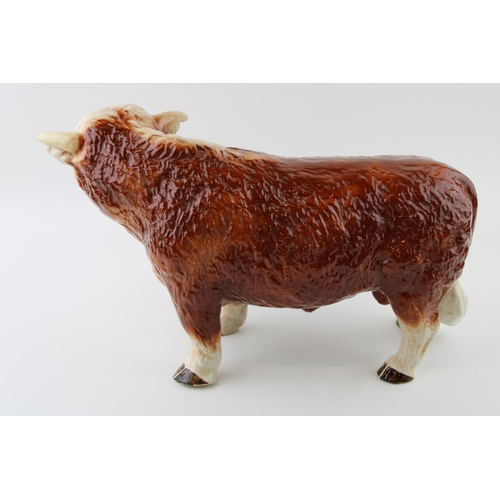 134 - A large mid 20th century Melba Ware butchers shop advertising figure of a Hereford Bull, with horns,... 