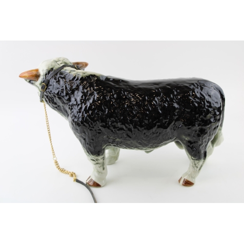 135 - A large mid 20th century butchers shop advertising figure of a Hereford Bull, unusual darker colour,... 