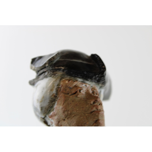 137 - A studio pottery figure of a gentleman in Tricorn hat on marble base. Indistinguishable monogram / s... 