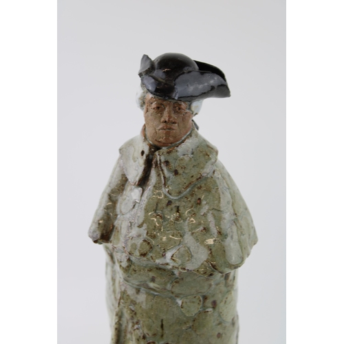 137 - A studio pottery figure of a gentleman in Tricorn hat on marble base. Indistinguishable monogram / s... 