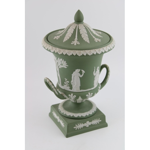 139 - A Wedgwood Sage Green Jasperware Campana Pedestal Urn Vase. Decorated with a frieze of classical fig... 