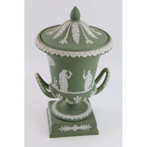 139 - A Wedgwood Sage Green Jasperware Campana Pedestal Urn Vase. Decorated with a frieze of classical fig... 