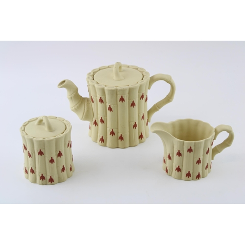 140 - Wedgwood Jasperware in yellow cane colour, with terracotta relief, to include a teapot, a milk jug a... 