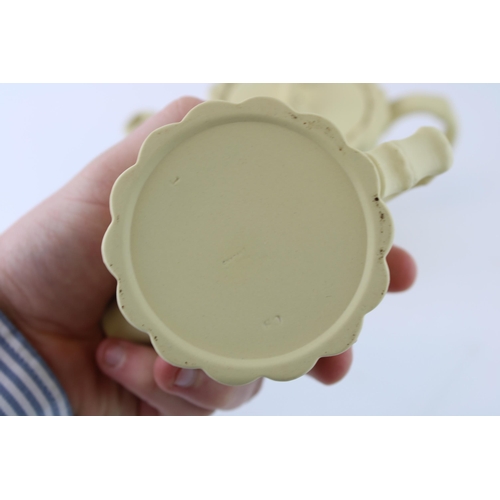 140 - Wedgwood Jasperware in yellow cane colour, with terracotta relief, to include a teapot, a milk jug a... 