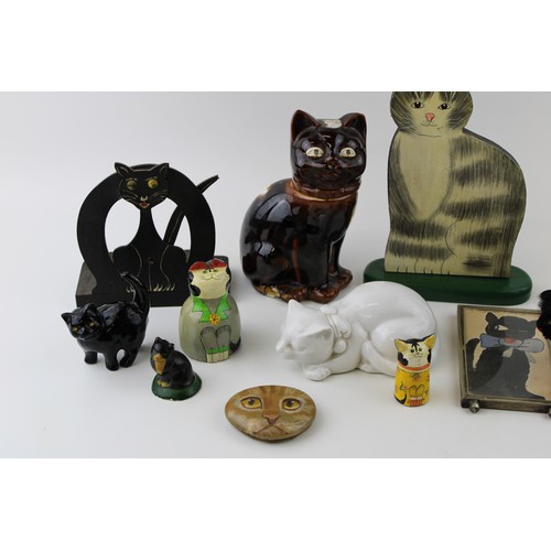 192 - A collection of vintage cat related items to include pottery figures, art deco wood and original art... 