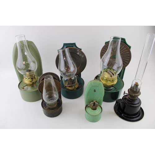 459 - A mixed collection of vintage and antique tin Oil Lamps with glass chimneys and parts