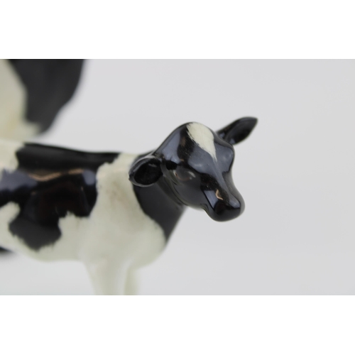 39 - Beswick Friesian Cow (horns af / broken) with a Calf (ear chipped) (2).