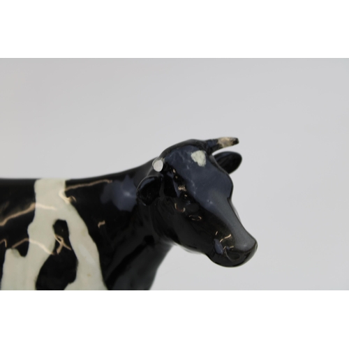 39 - Beswick Friesian Cow (horns af / broken) with a Calf (ear chipped) (2).