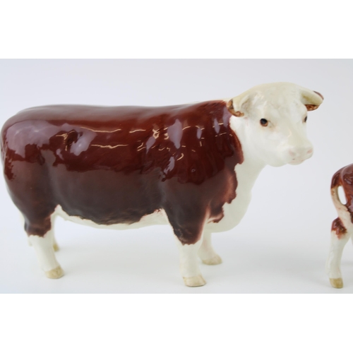 44 - Beswick Hereford Cow (grazed ear) with a Hereford Calf (ear repaired) (2).