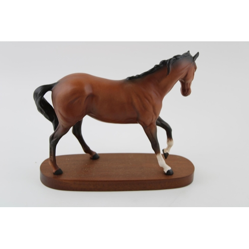 7 - Beswick Spirit of Youth in matte brown, wooden base.