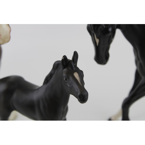 59 - Beswick to include a brown 818 shire, Black Beauty and Foal (3).