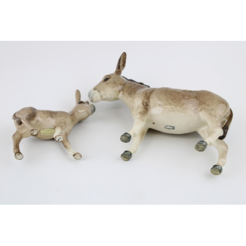 69 - Two Beswick Donkeys to include a foal (2).