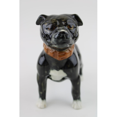 79 - A large pottery model of a Staffordshire Bull Terrier, in brindle colourway, wearing collar, unmarke... 