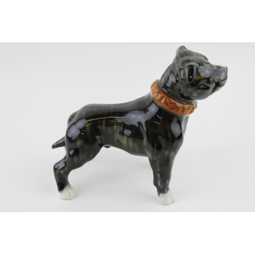 79 - A large pottery model of a Staffordshire Bull Terrier, in brindle colourway, wearing collar, unmarke... 