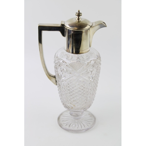 12 - Silver plated cut glass claret jug, 28cm tall.