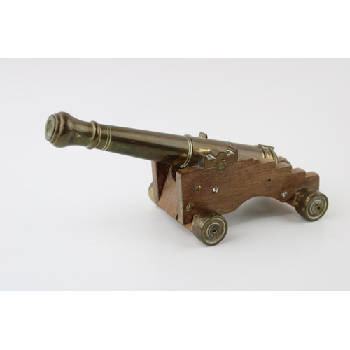 15 - Vintage brass and wood cannon model, 19cm long.