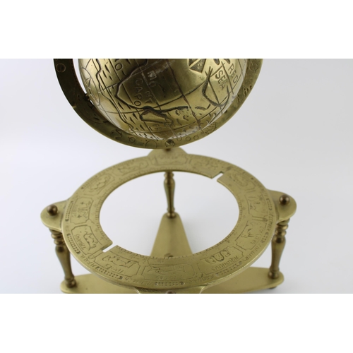 16 - Vintage cast brass spinning globe, brass stand, 25cm tall.