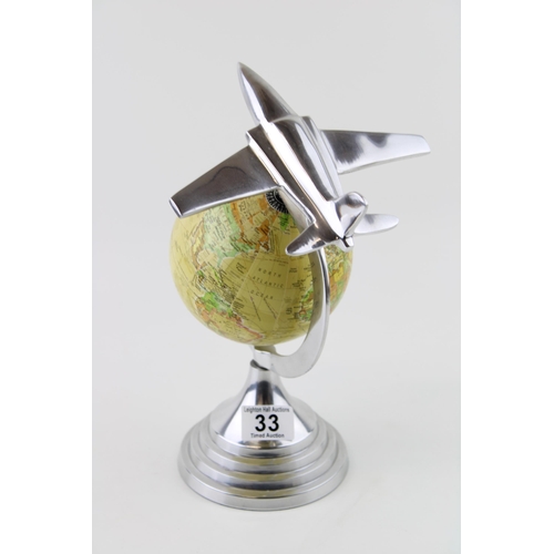 33 - An Art Deco style globe with aeroplane design in chrome to surround. Height 30cm.