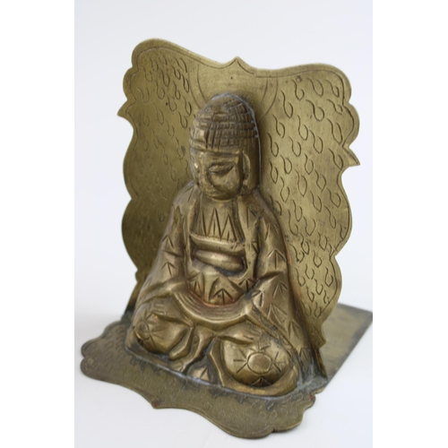 38 - A pair of brass bookends in the form of buddhas. Height 16.5cm.