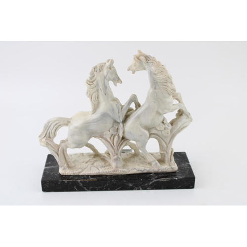 39 - Marble style statue of two rearing horses. Height 19cm.