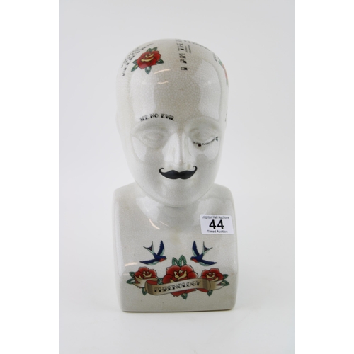 44 - A ceramic Phrenology head with vintage tattoo style decoration. Height 30cm.