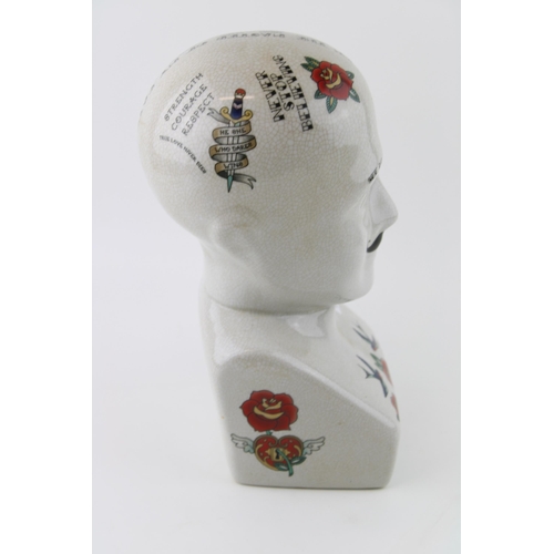 44 - A ceramic Phrenology head with vintage tattoo style decoration. Height 30cm.