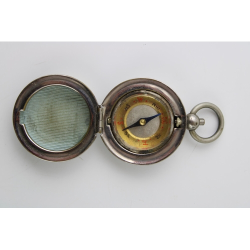 78 - A sovereign case, metal, with internal compass, 5cm long.