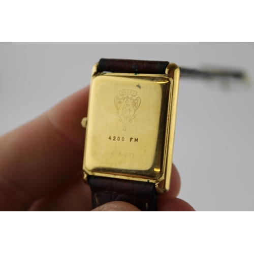 101 - A vintage gentleman's Gucci gold plated watch on leather strap in original box. Case diameter 24mm.