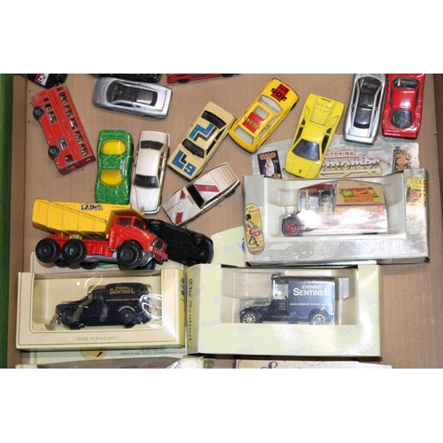 105 - A collection of vintage die cast models to include boxed and play worn examples. (Qty)