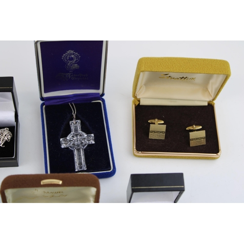 106 - A collection of boxed vintage cufflinks, a Waterford Crystal Celtic cross on silver chain, a silver ... 