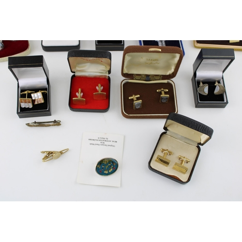 106 - A collection of boxed vintage cufflinks, a Waterford Crystal Celtic cross on silver chain, a silver ... 