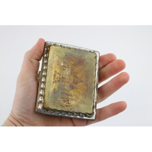 123 - A boxed Map Measure, appears to be working, with an Eastern silver plated and brass cigarette case (... 