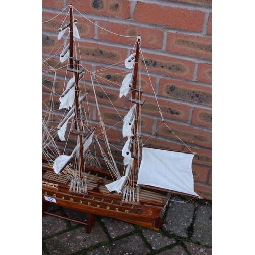 32 - A model of sail boat / Galleon constructed out of wood on stand. Height 74cm. Width 90cm.