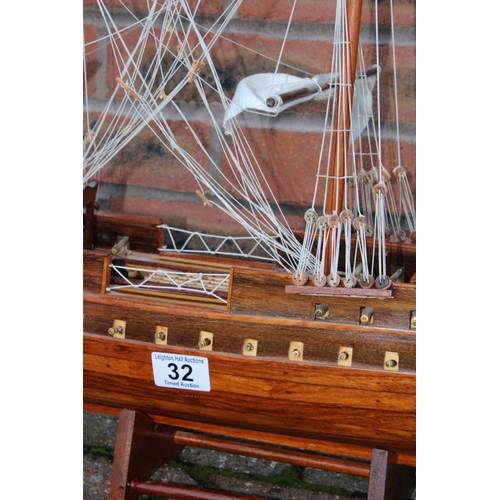 32 - A model of sail boat / Galleon constructed out of wood on stand. Height 74cm. Width 90cm.