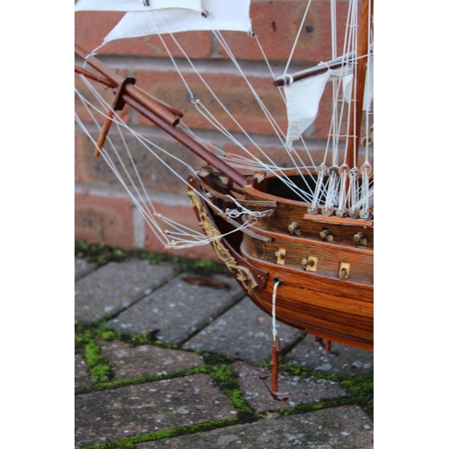 32 - A model of sail boat / Galleon constructed out of wood on stand. Height 74cm. Width 90cm.