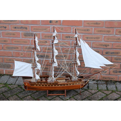 32 - A model of sail boat / Galleon constructed out of wood on stand. Height 74cm. Width 90cm.