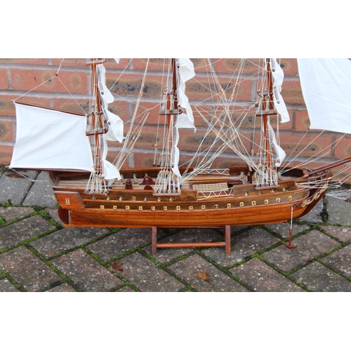 32 - A model of sail boat / Galleon constructed out of wood on stand. Height 74cm. Width 90cm.