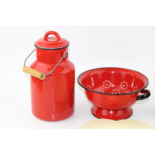 42 - A collection of red enamelled kitchenalia items together with a yellow serving tray with chrome hand... 