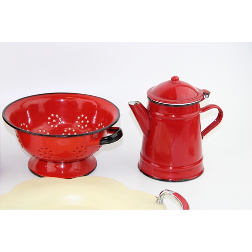 42 - A collection of red enamelled kitchenalia items together with a yellow serving tray with chrome hand... 