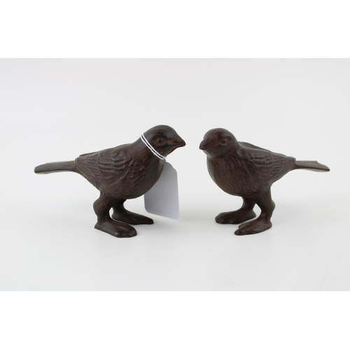 92 - A pair of contemporary cast metal bird figures, 12cm wide (2).