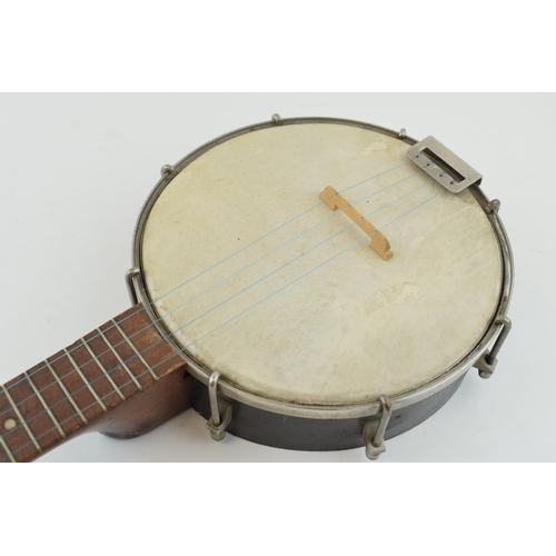 230 - A vintage Banjolele / Ukulele. Wooden neck and wooden body. Length 56cm.