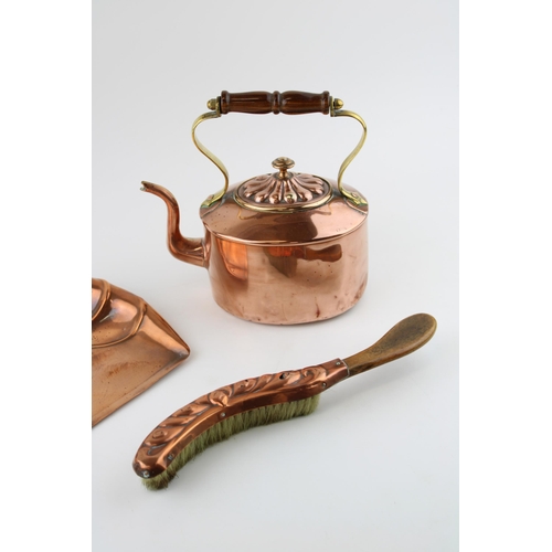 129 - An antique copper kettle together with a Art Nouveaux crumb tray. (2)