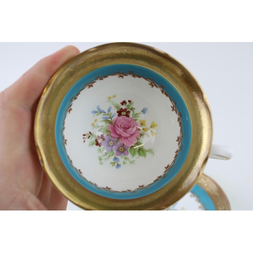 133 - A Royal Grafton cabinet cup and saucer, heavily gilded with blue ground and cabbage rose design. Hei... 